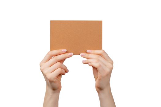 Woman hand hold business blank paper card isolated on white background, close up