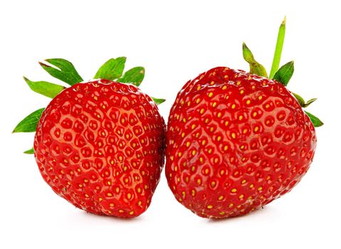 Two strawberries isolated on white background