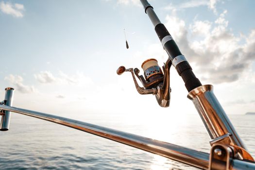 Fishing rod on a sailboat on the background of the open sea