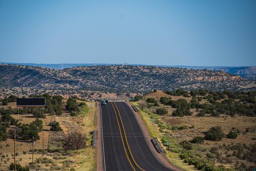 Natural american landscape with asphalt road to horizon