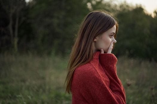 woman outdoors in a field walk fresh air. High quality photo