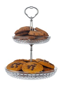 Glass cookie jar with chocolate chip cookies inside isolated on white background