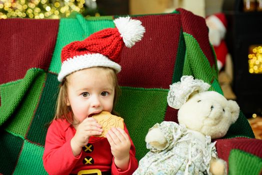 Christmas funny portrait of cute little baby in santa hat