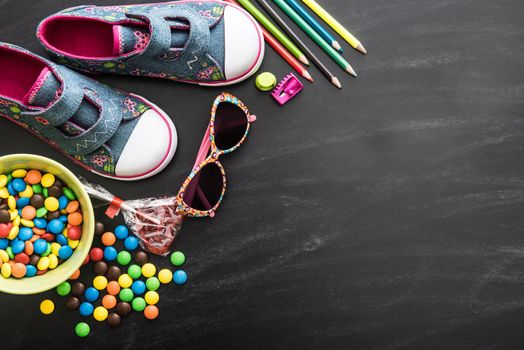 kid's stuff and sweets on a white background