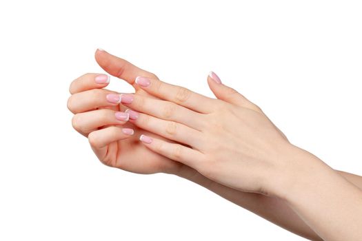 Well-groomed female hands with manicure on white background close up
