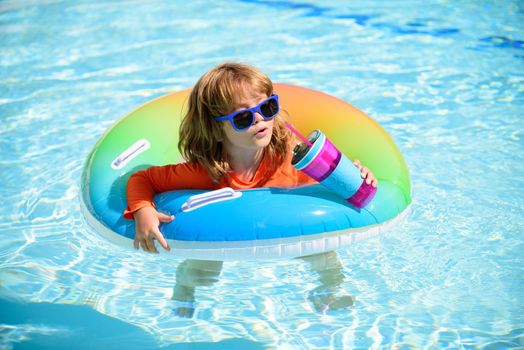 Summer vacation. Cute kid in swimming pool
