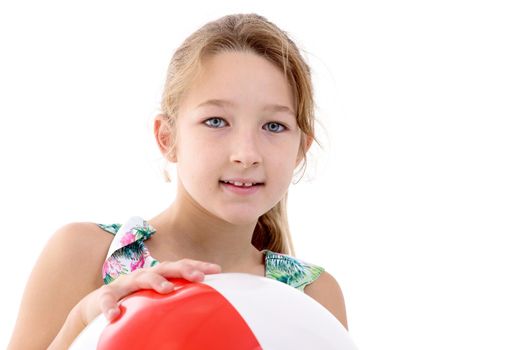 A little girl in a swimsuit is playing with a big ball. The concept of a family vacation, Memories of a happy vacation at sea.Isolated on white background.