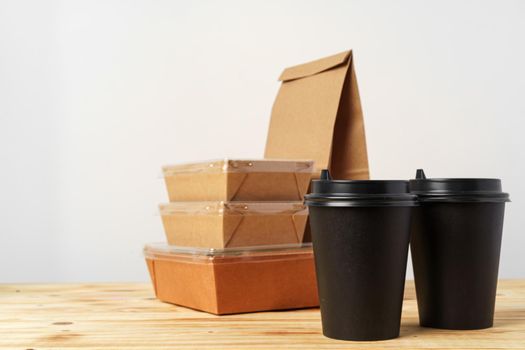 Paper bags with take away food and coffee cups containers. Lunch box