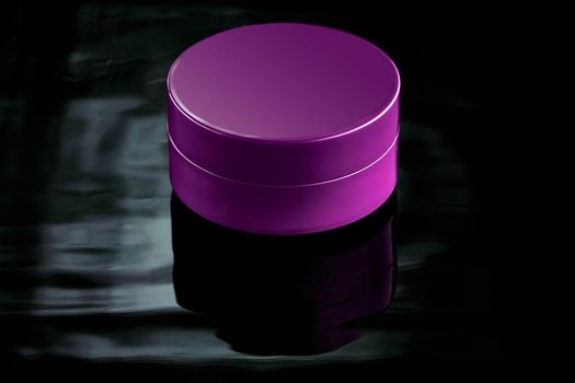 Pink plastic jar in water on a dark background. Mockup for advertising cosmetics and body care products. Layout of a moisturizer, milk or balm