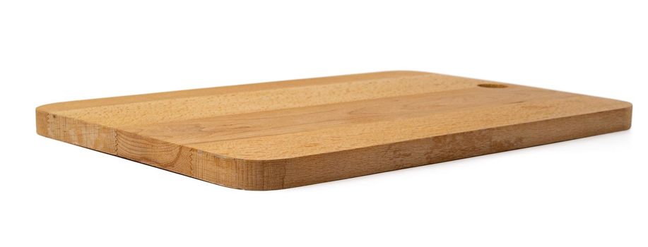 Wooden cutting board on a white background, close up