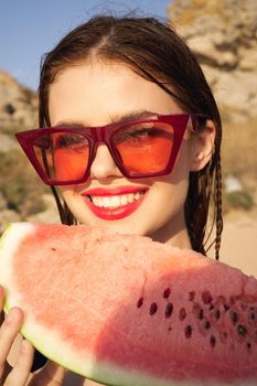 woman eating watermelon outdoors Sun summer close-up. High quality photo