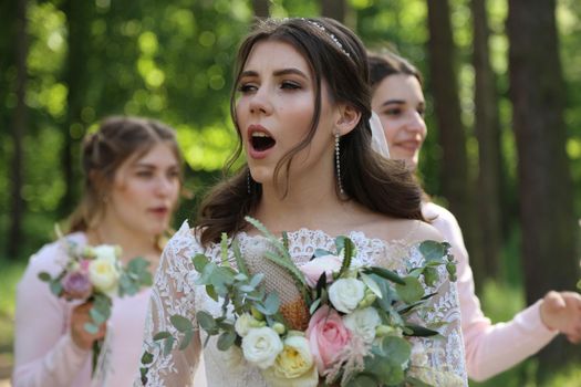 Wedding photography in rustic style emotions of the bride on the nature on the rocks