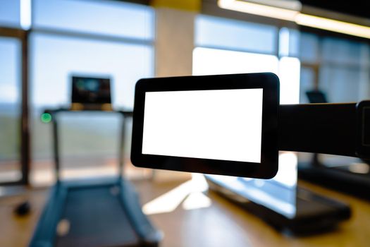 Close up of white screen on gym apparatus in a luxury gym, copy space