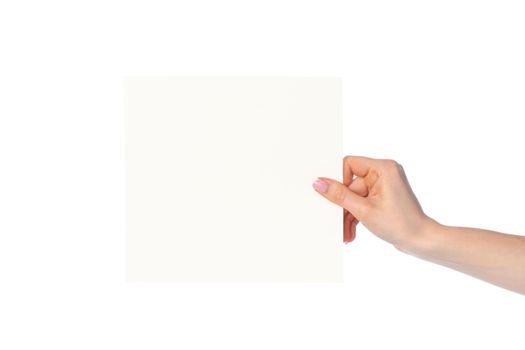 Woman's hand showing white paper banner isolated on white background