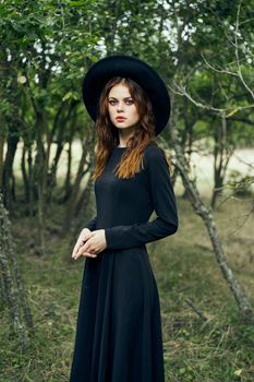 witch in the woods posing costume halloween gothic style. High quality photo