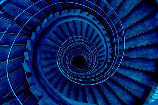 Spiral staircase goes in the centre, looks like a snail. Toned in classic blue, the color of the year