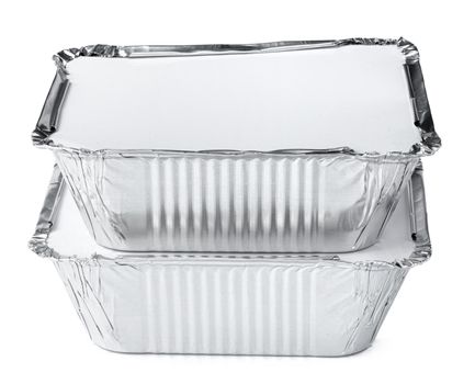 Packed foil food boxes on white background, copy space, close up