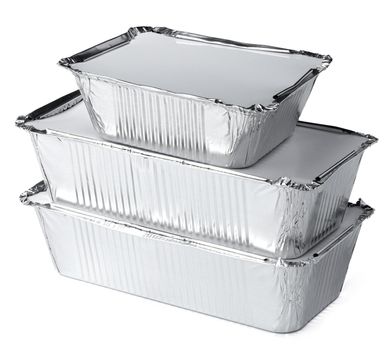 Packed foil food boxes on white background, copy space, close up