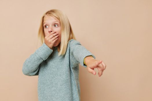 happy child gestures with his hands cropped view. High quality photo