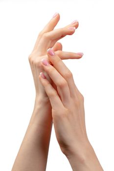 Well-groomed female hands with manicure on white background close up