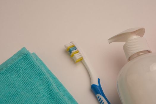 bathroom items hygiene care toothbrush light background. High quality photo