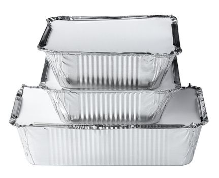 Packed foil food boxes on white background, copy space, close up