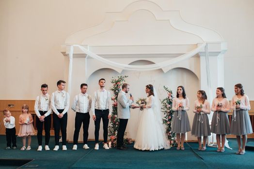 SACRAMENTO, USA - MAY 12 th 2018: The bride and groom get married and receive a blessing in the church building in the presence of guests