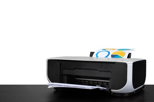 Laser home printer on table against white background, close up