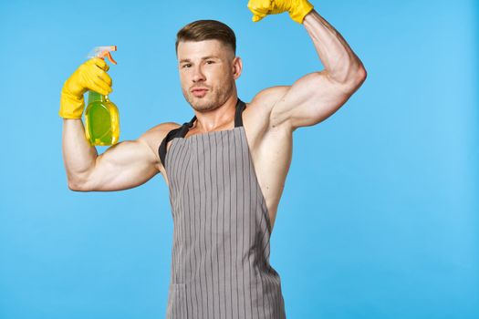 man wearing an apron detergent cleaning service housework. High quality photo