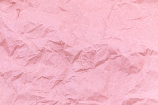 Texture of pink craft crumpled paper background.