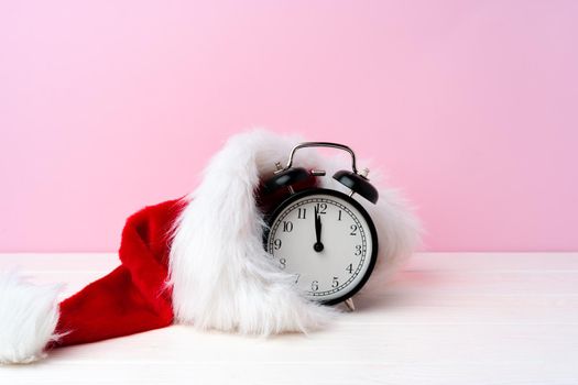 Christmas and New Year celebration countdown concept with alarm clock