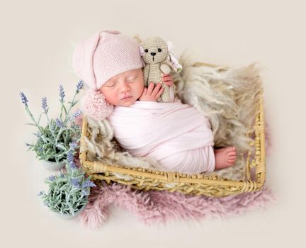 Beautiful newborn baby sleeping comfortable in cradle