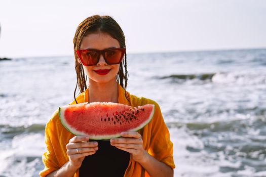 woman in swimsuit with watermelon outdoors sun fresh air. High quality photo