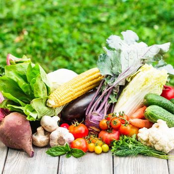 Various vegetables on a wooden table with copy space