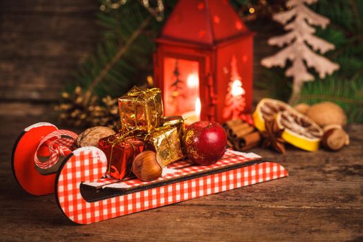 Decorative boxes and nuts on the sledges. Symbols of Christmas holiday