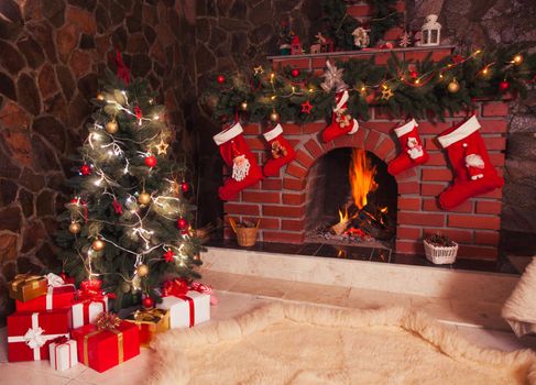 Christmas decorated fireplace and tree in the room