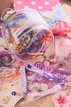 Scrapbooking craft materials in a glass bottle