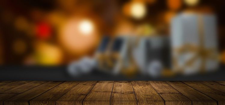 wood table with blured gifts bokeh background.