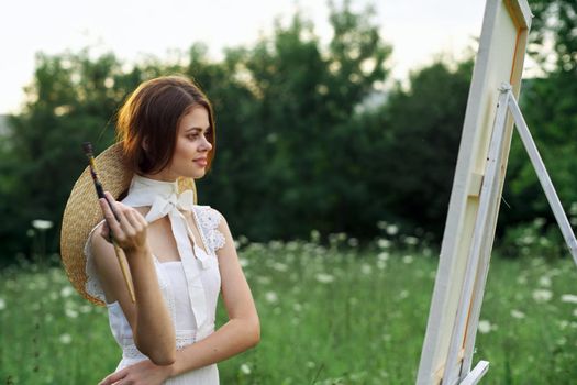 woman artist outdoors painting nature hobby art. High quality photo