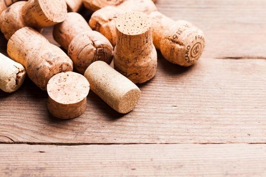 Corks on the wooden table. Wine and alcohol concept