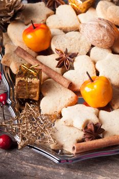 Christmas sweet decor - cookies, apple and spices on the tray