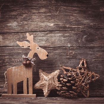 Natural christmas decor - deer over wooden background