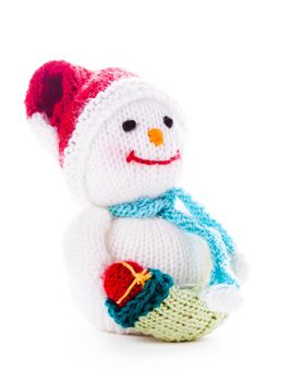 Knitted snowman with christmas santa boot isolated on white