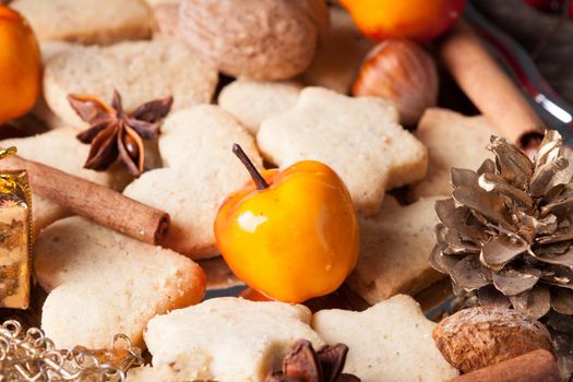 Christmas sweet decor - cookies, apple and spices on the tray