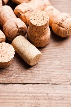 Corks on the wooden table. Wine and alcohol concept