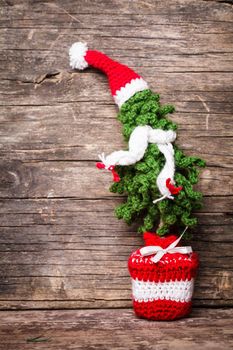 Crochet Christmas tree with scaf and Santa hat, cold winter style