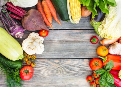 Various vegetables on a wooden table with copy space