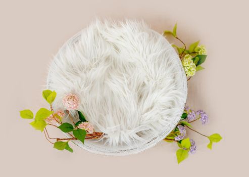 Beautiful newborn digital background for infant baby photosession. White basin with fur decorated hydrangea flowers