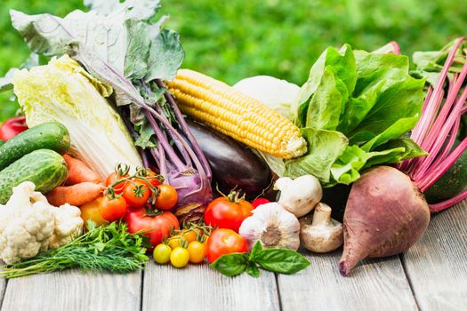 Various vegetables on a wooden table with copy space