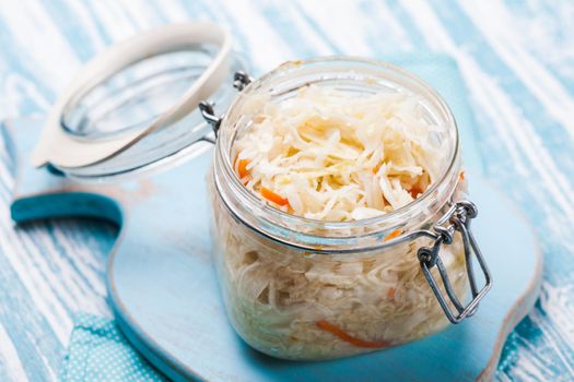 sauerkraut in a glass jar on the table